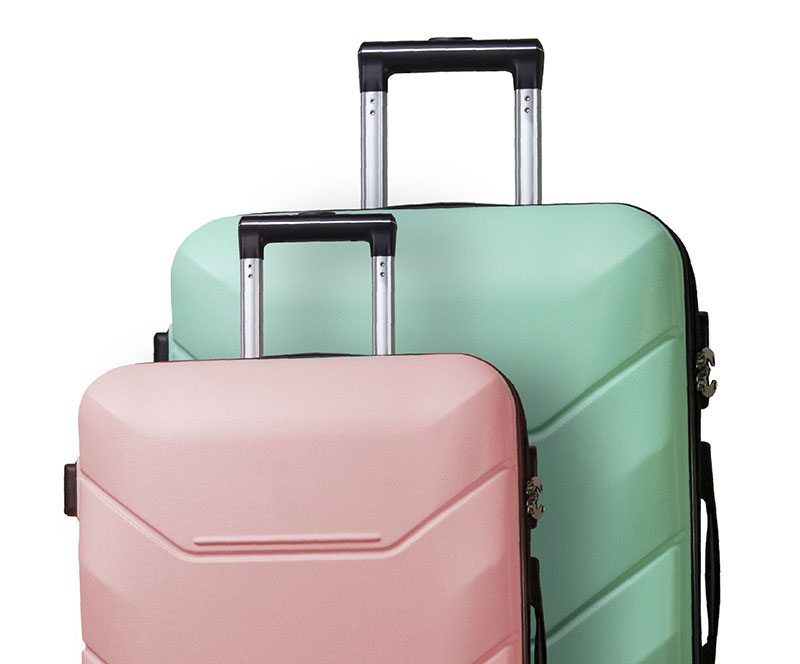 Two Suitcases on wheels on a white isolated background. Сoncept